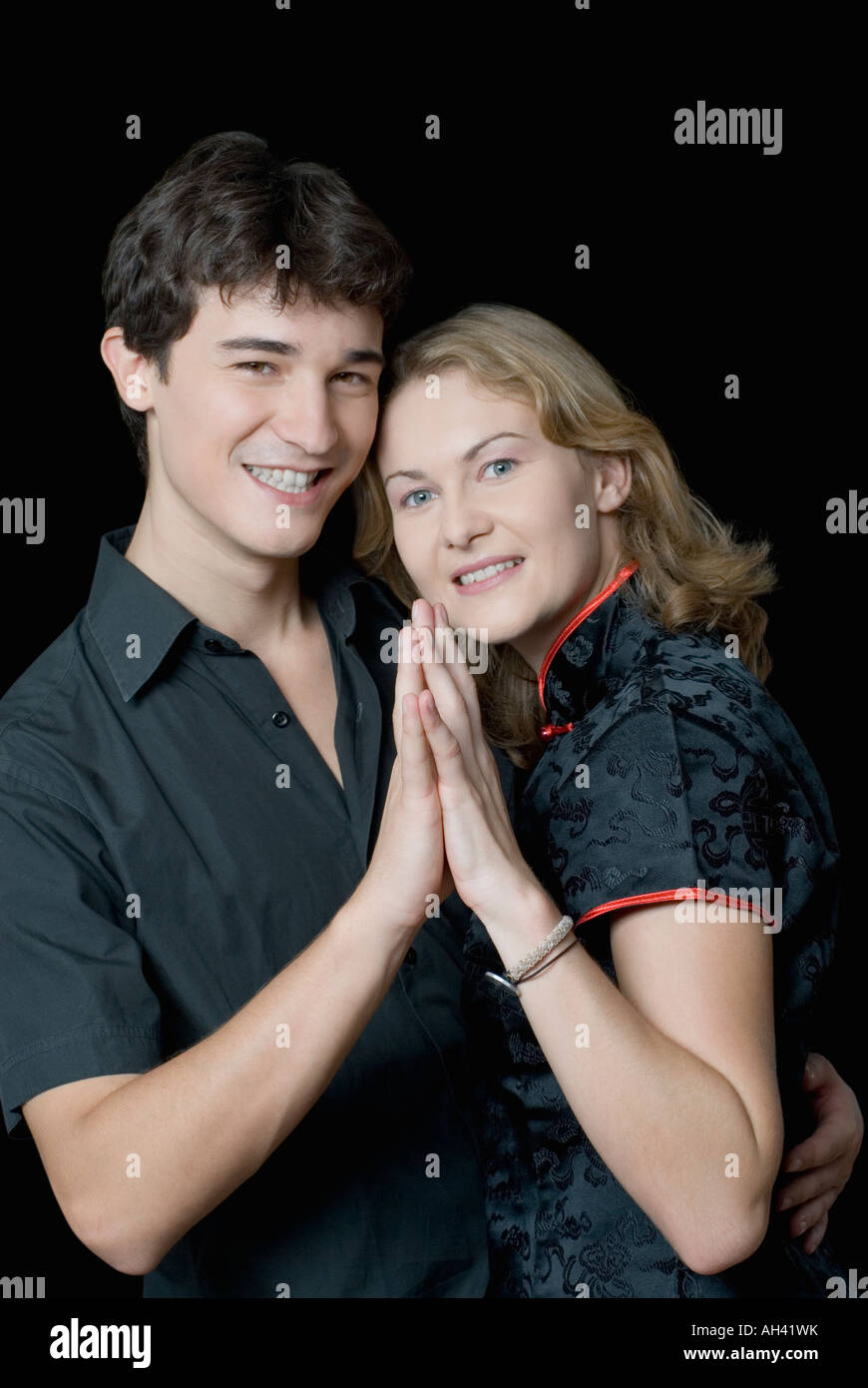 Portrait of a young man embracing a young woman Stock Photo - Alamy