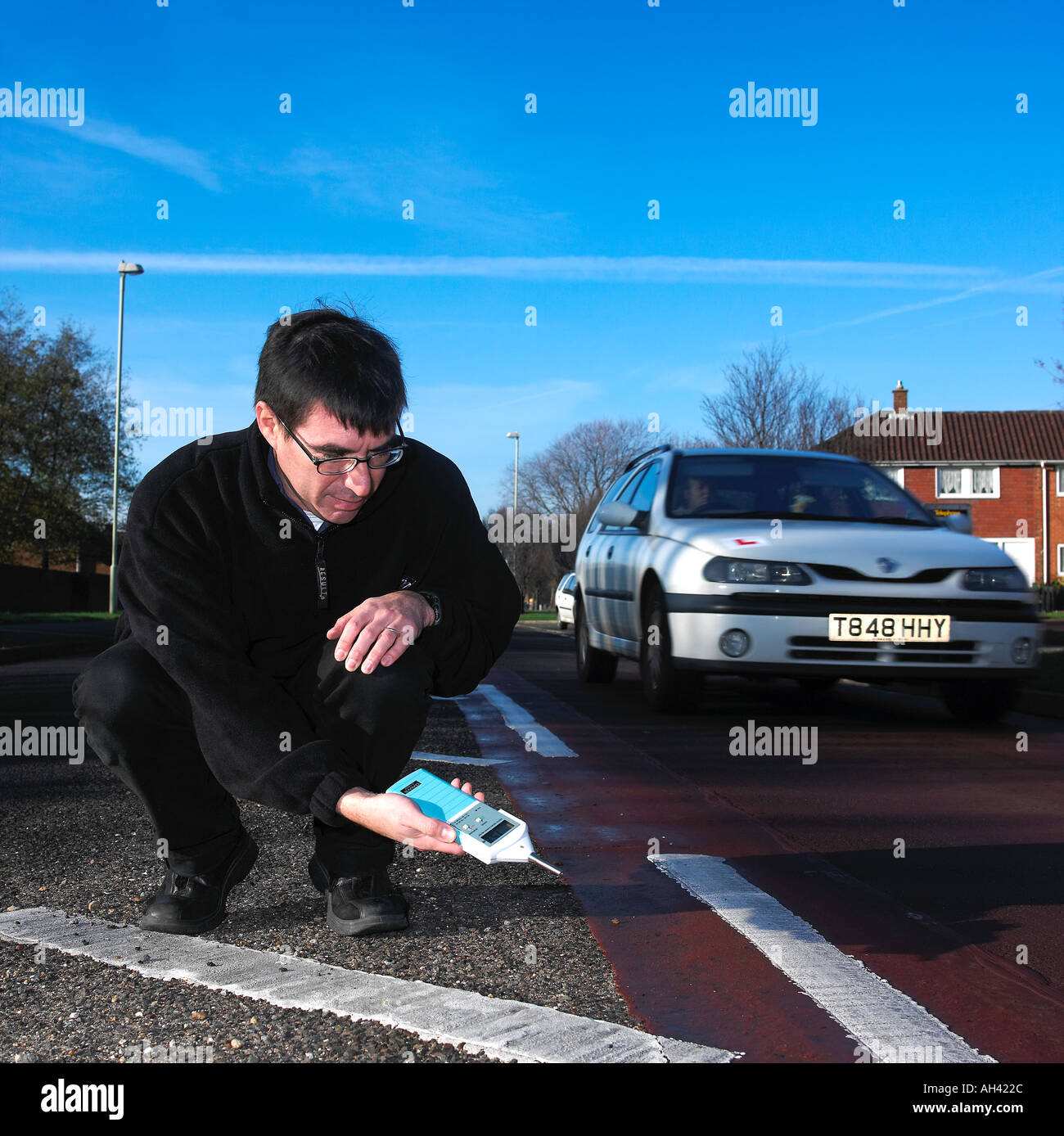 2003 Metering for road noise at new traffic calming ripple surface Stock Photo