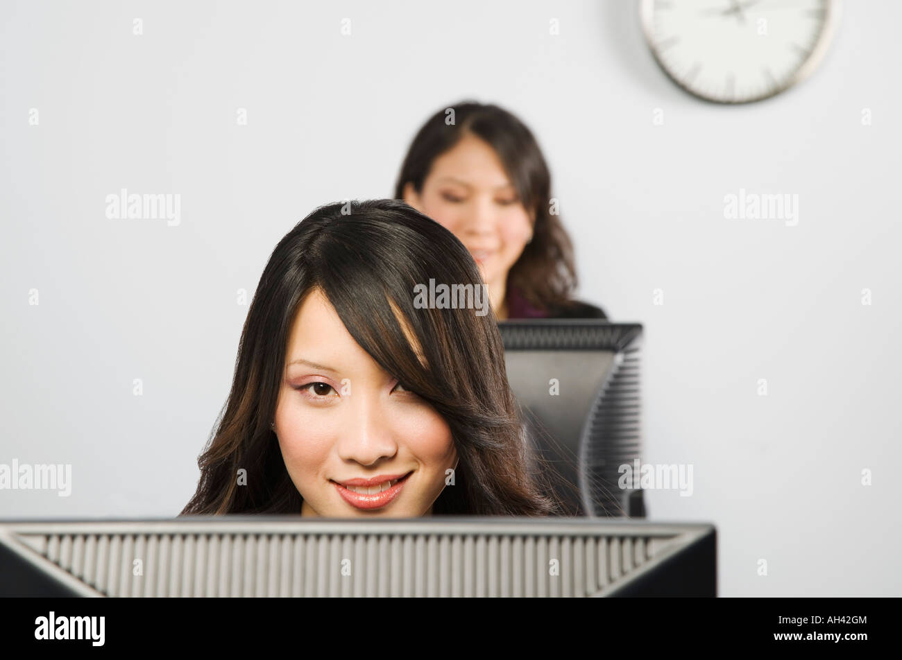 Females in front of monitors Stock Photo