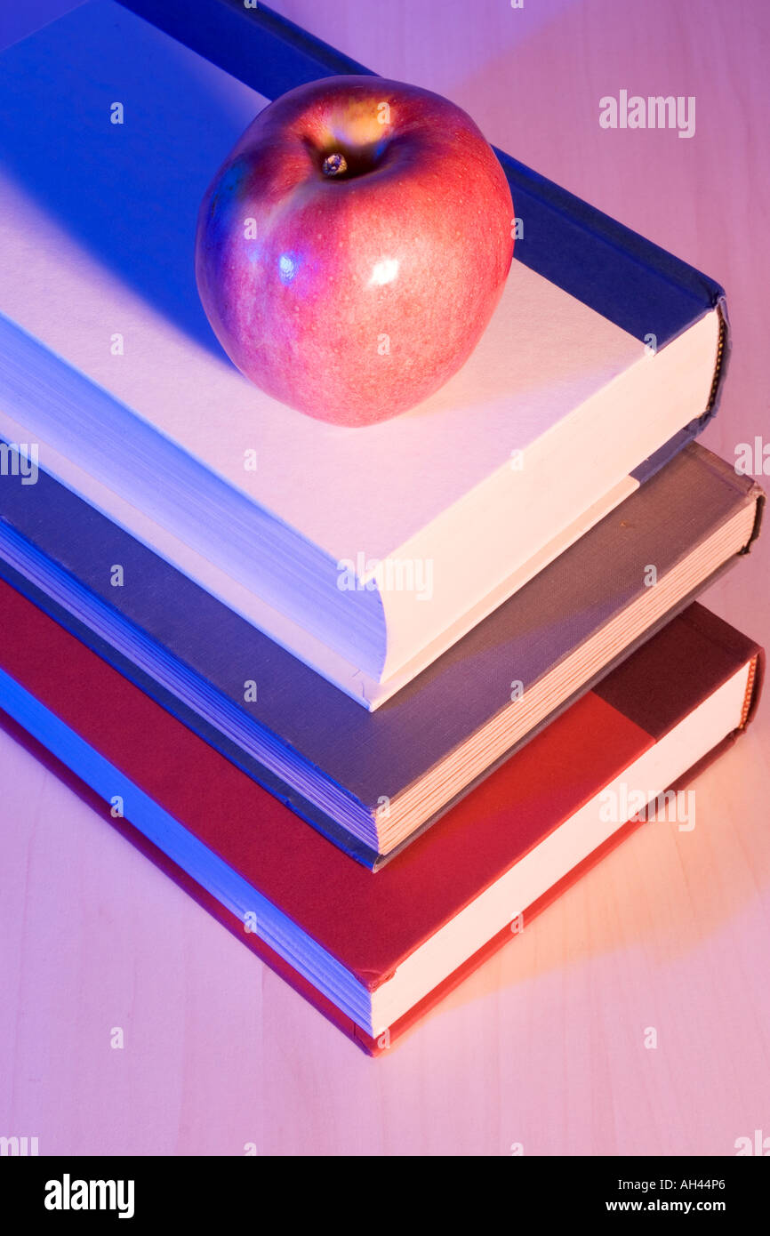 Apple on stack of books Stock Photo