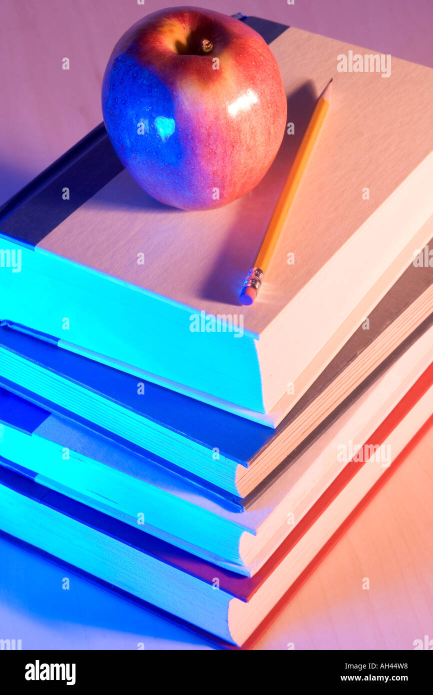 Apple and pencil on books Stock Photo