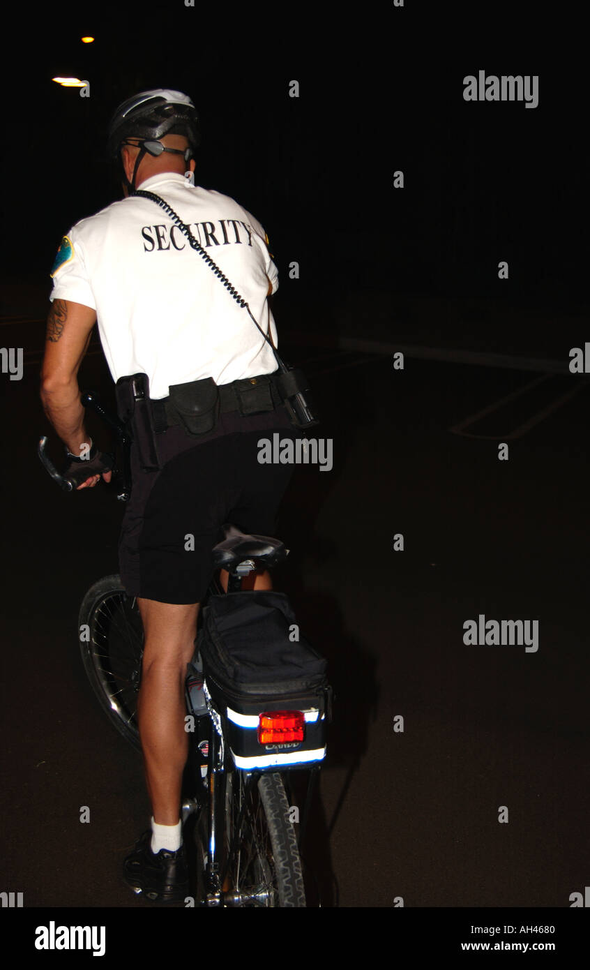 Security guard on bicycle Stock Photo Alamy