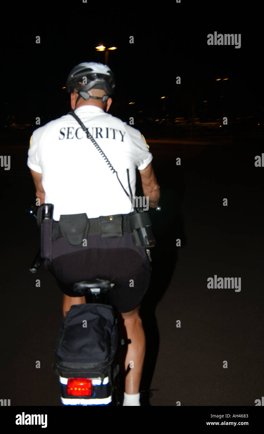 Security guard on bicycle Stock Photo Alamy