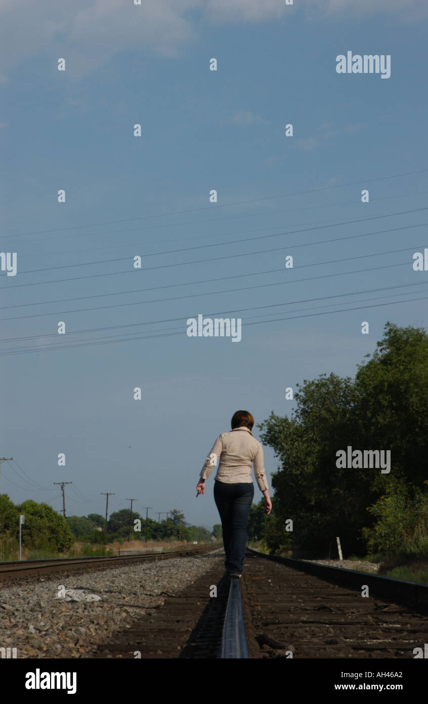 Girl dancing on train tracks Stock Photo Alamy