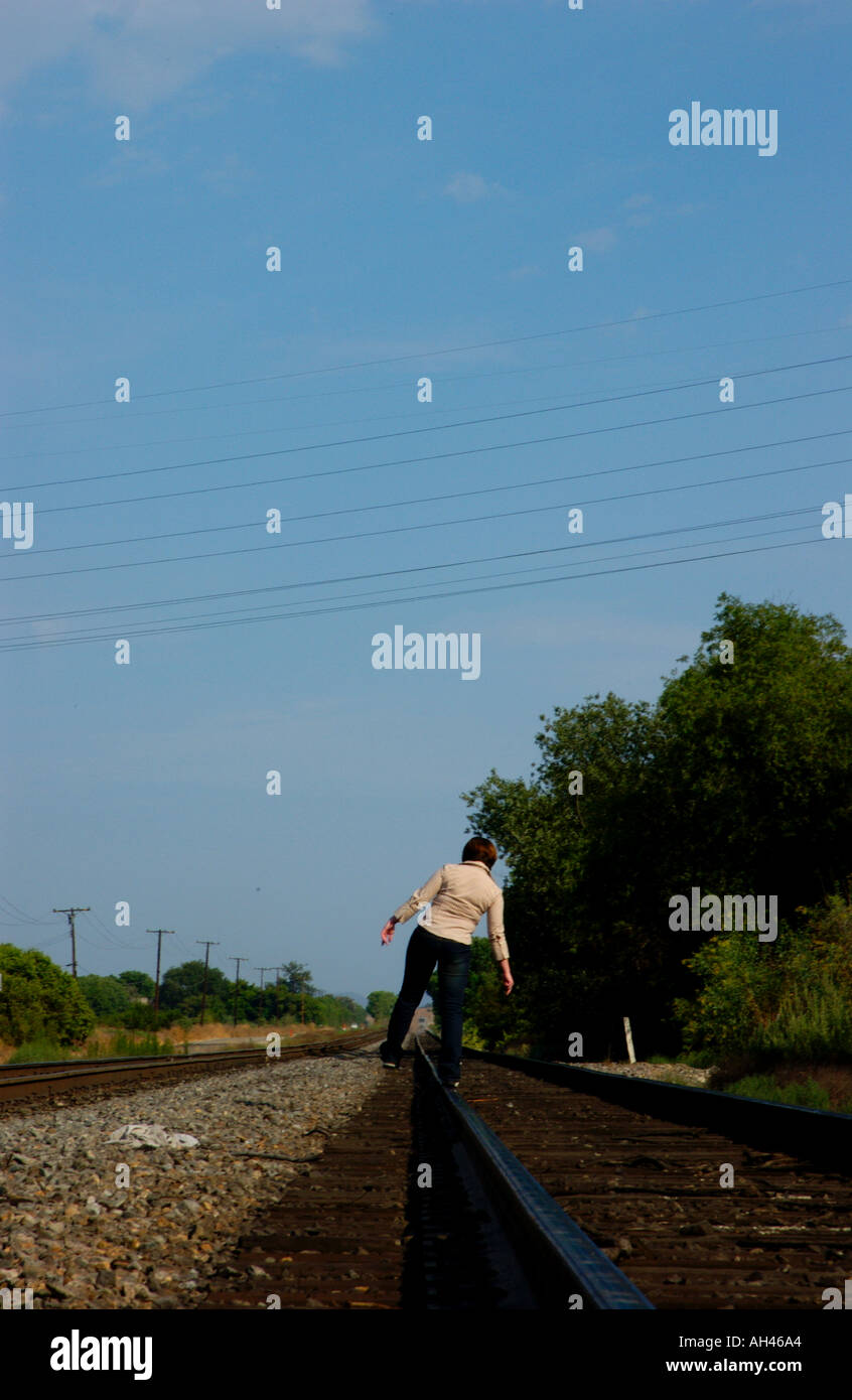 Girl dancing on train tracks Stock Photo Alamy