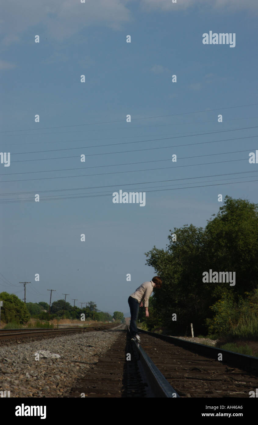 Girl dancing on train tracks Stock Photo Alamy
