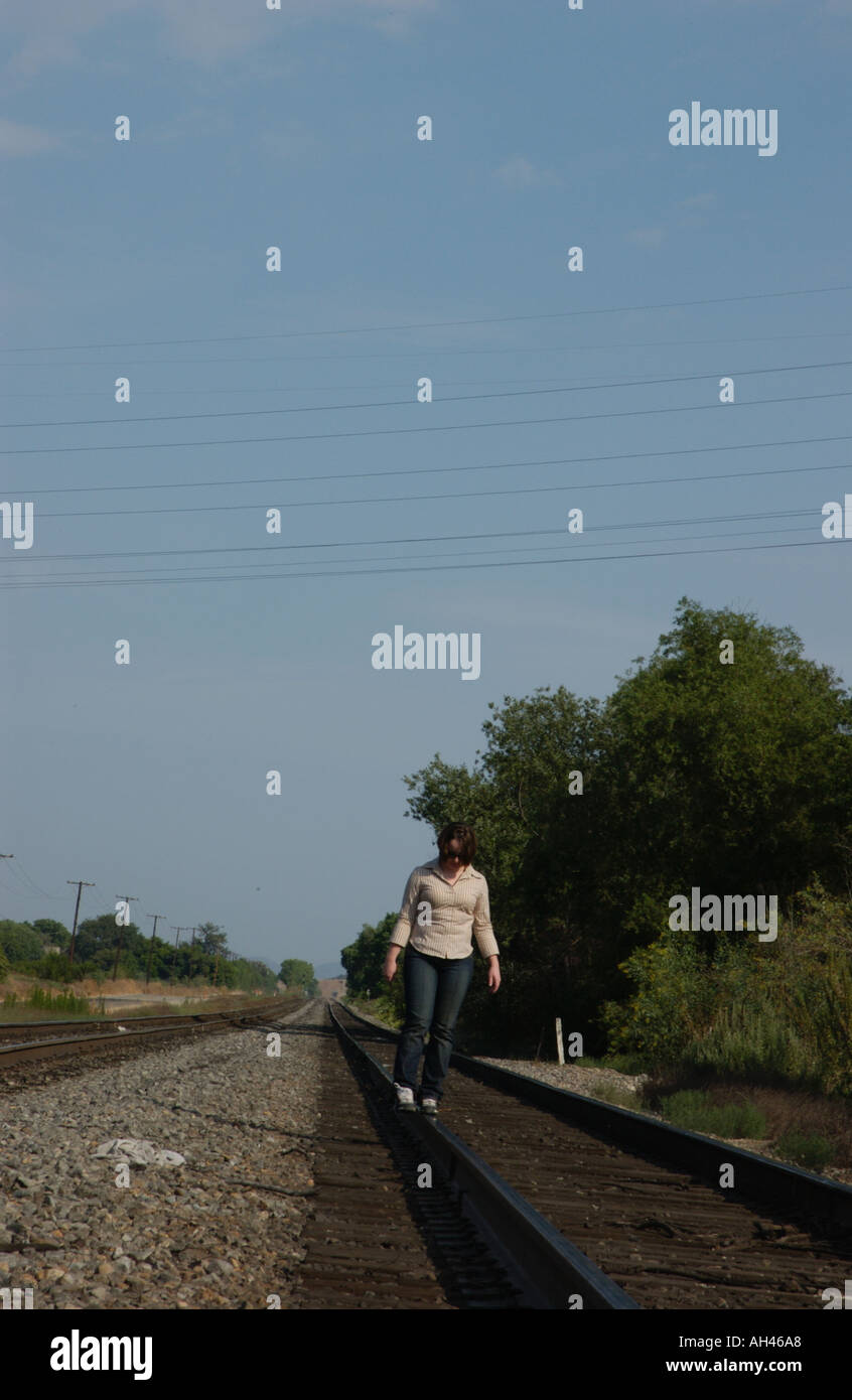 Girl dancing on train tracks Stock Photo Alamy