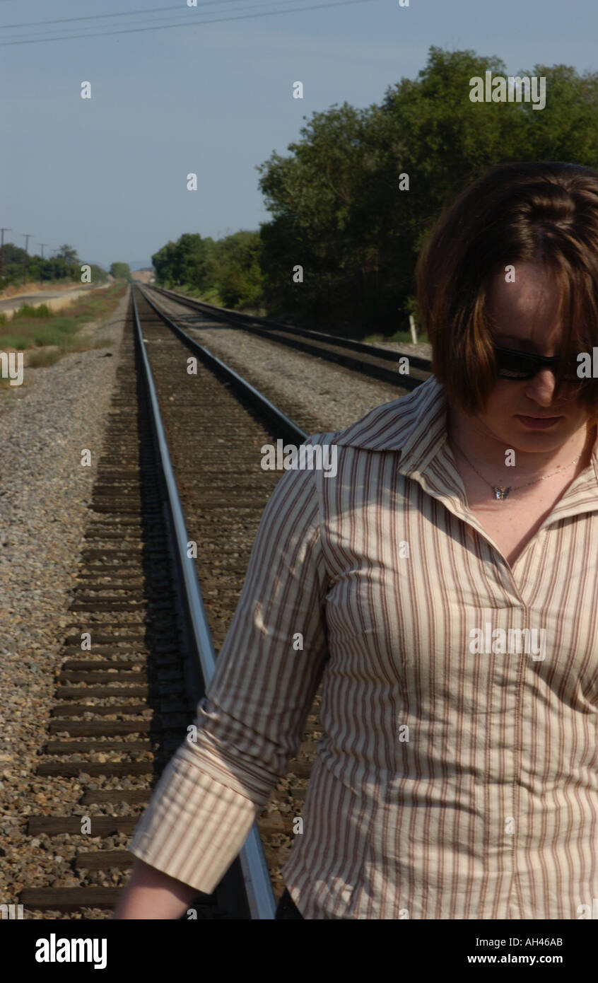 Girl dancing on train tracks Stock Photo Alamy