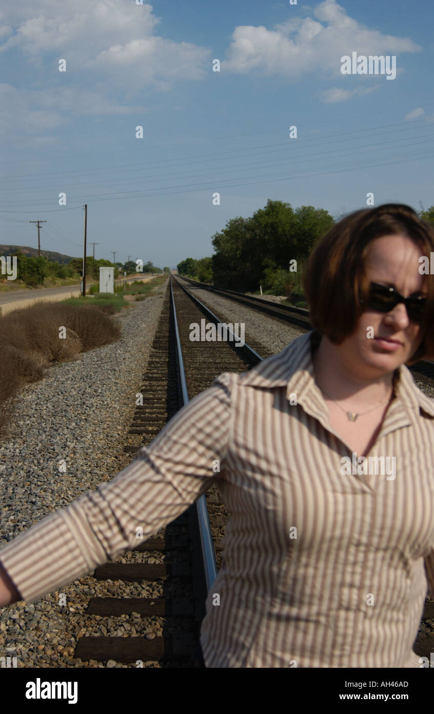 Girl dancing on train tracks Stock Photo Alamy