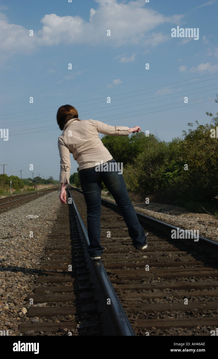 Girl dancing on train tracks Stock Photo Alamy