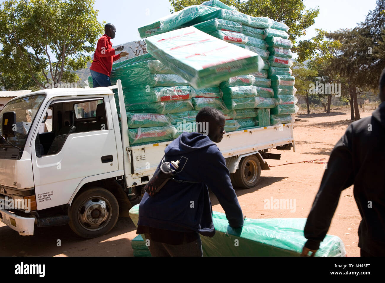 A delivery of new mattresses at the Home of Hope orphanage, Malawi
