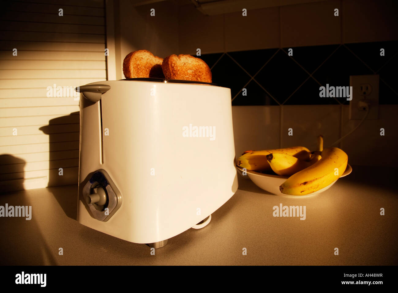 Toaster with toast and bananas Stock Photo Alamy