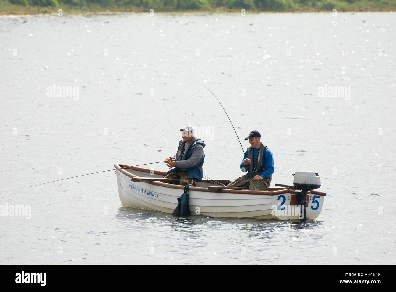 Two Men in a boat fishing at Pitsford Reservoir Stock Photo - Alamy