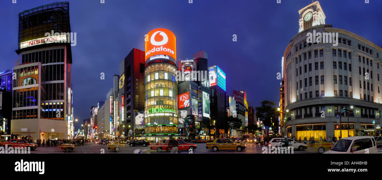 neon lights and traffic at intersection in Ginza, Tokyo, Japan Stock Photo