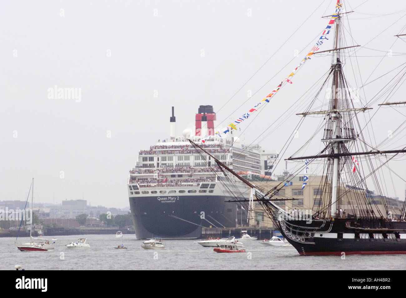 USS Constitution passes by the Queen Mary 2 July 4 2006 Stock Photo