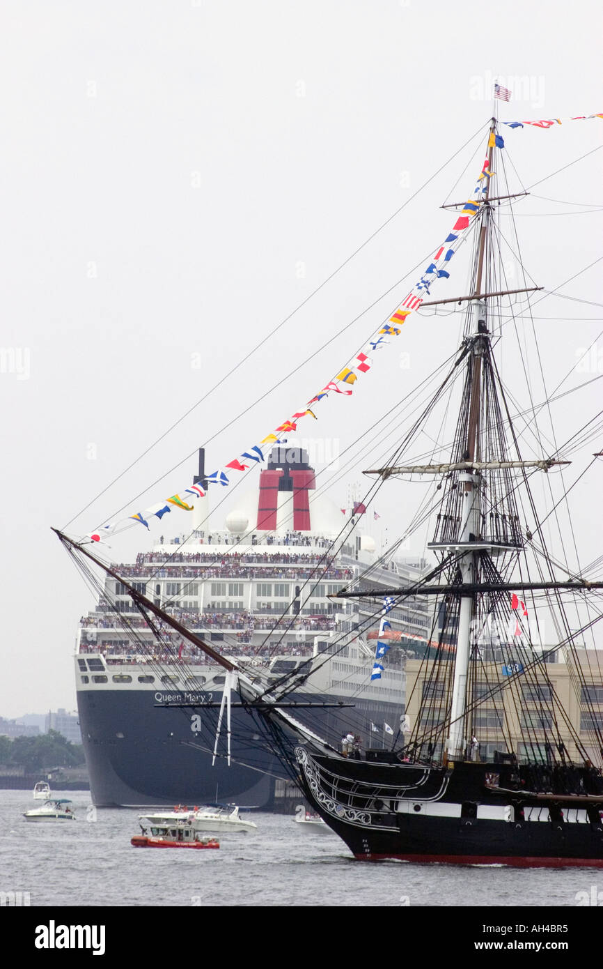 USS Constitution sails past the Queen Mary 2 on annual turn around cruise July 4 2006 Stock Photo