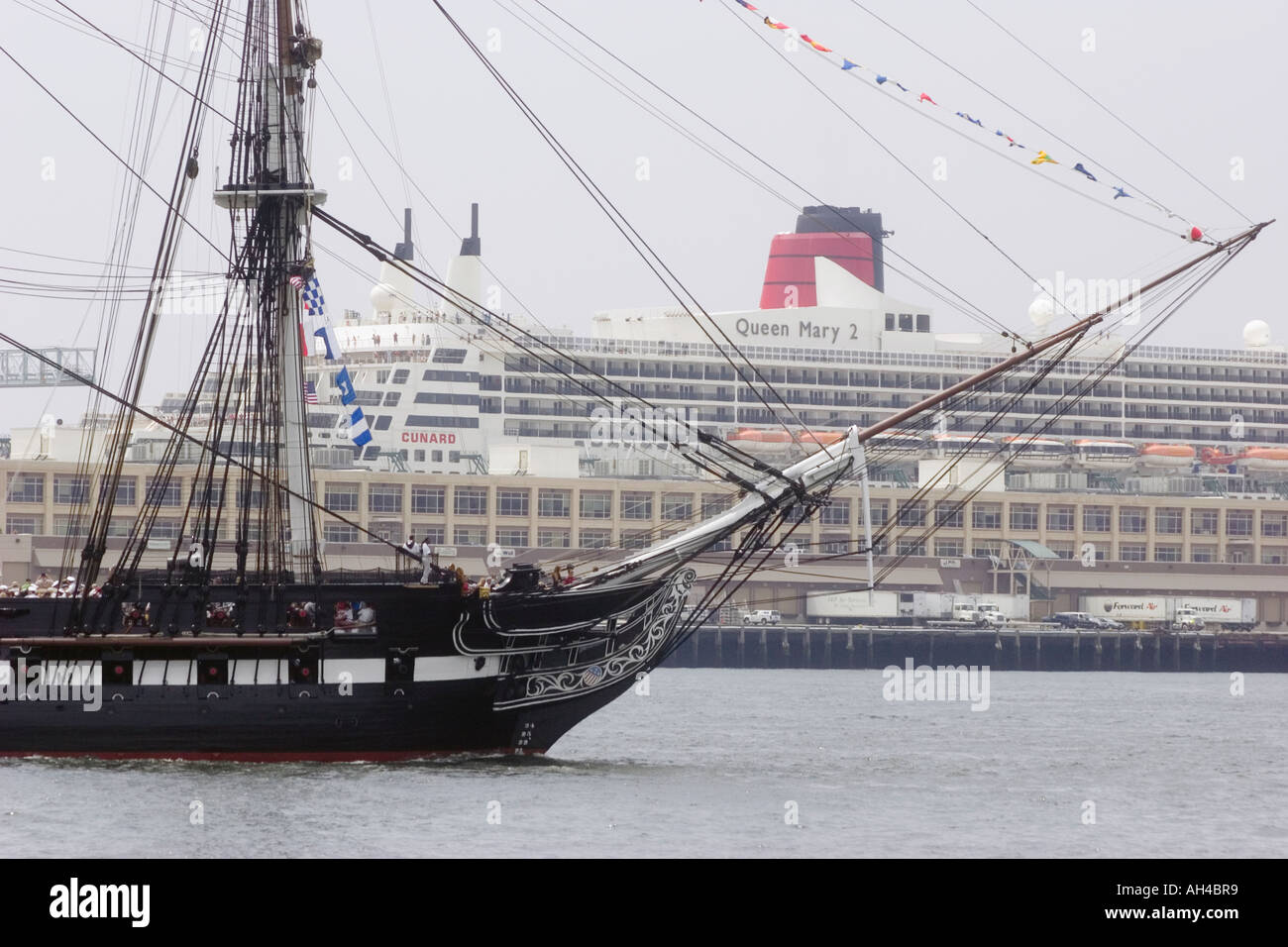 USS Constitution sails past the Queen Mary 2 on annual turn around cruise July 4 2006 Stock Photo