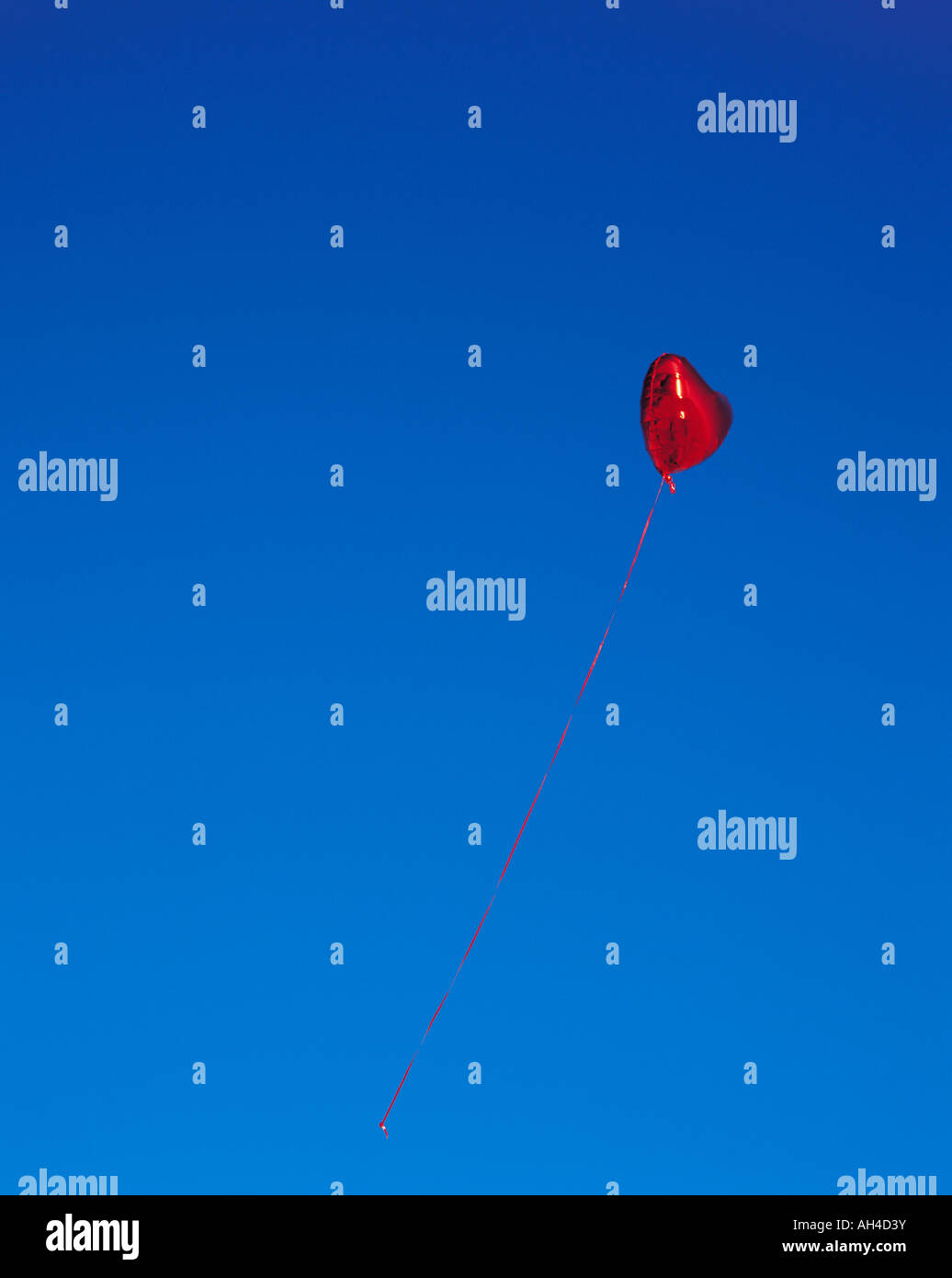 A heart-shaped balloon in the sky Stock Photo - Alamy