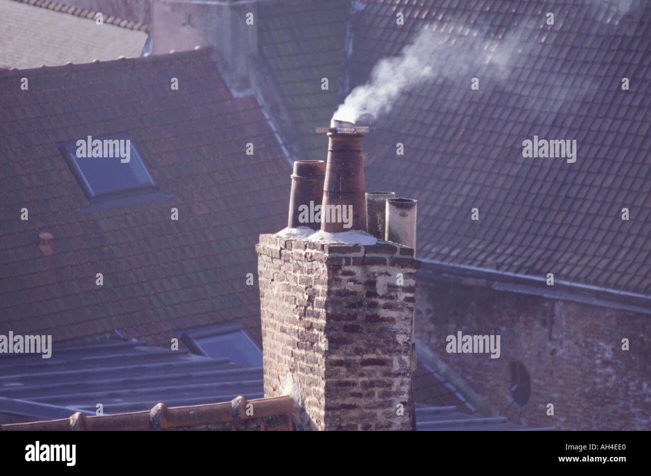 Smoking chimney on a historic 17th century home in Cassel northern France Stock Photo
