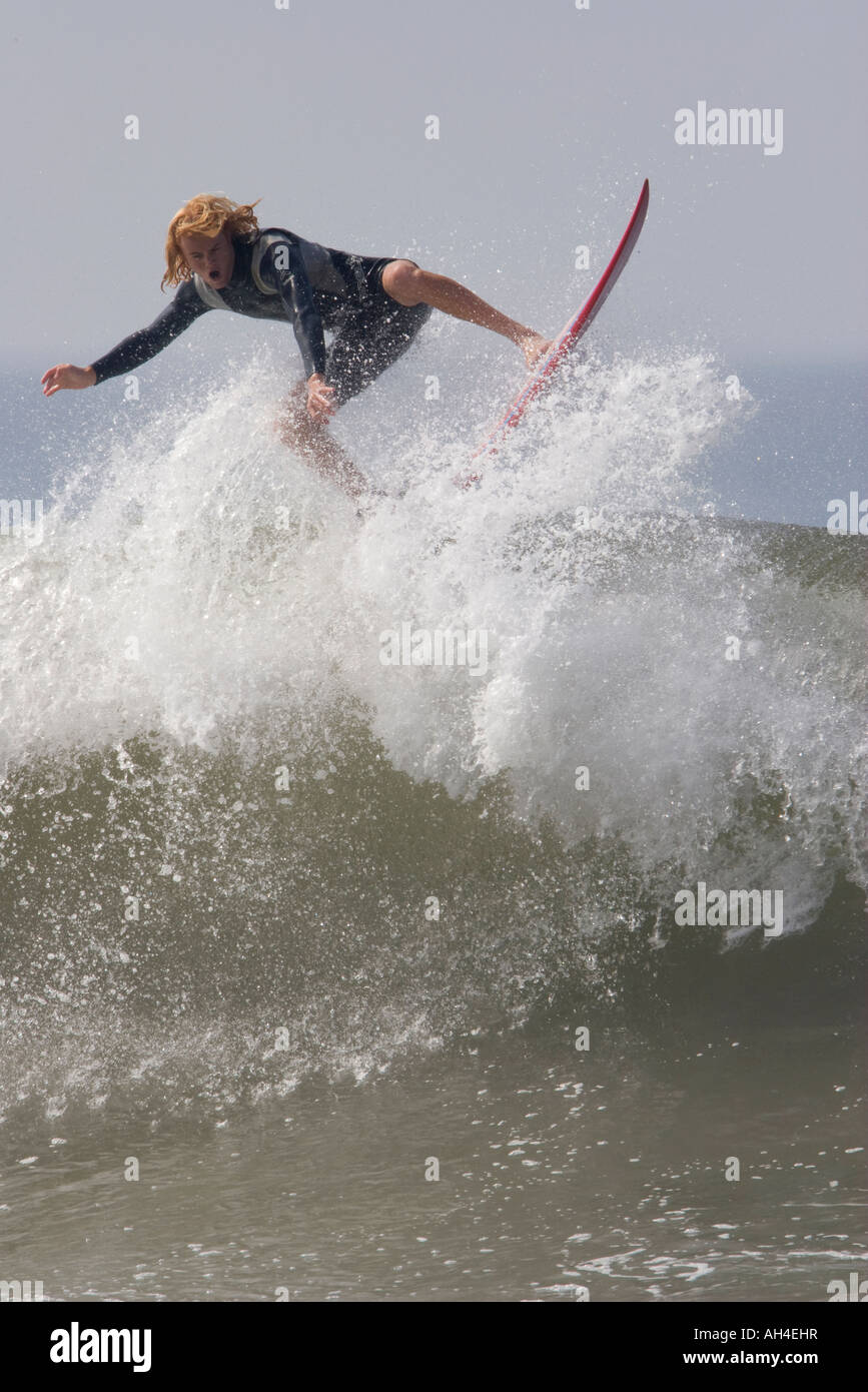 Surfer Riding High on the Crest Stock Photo - Alamy
