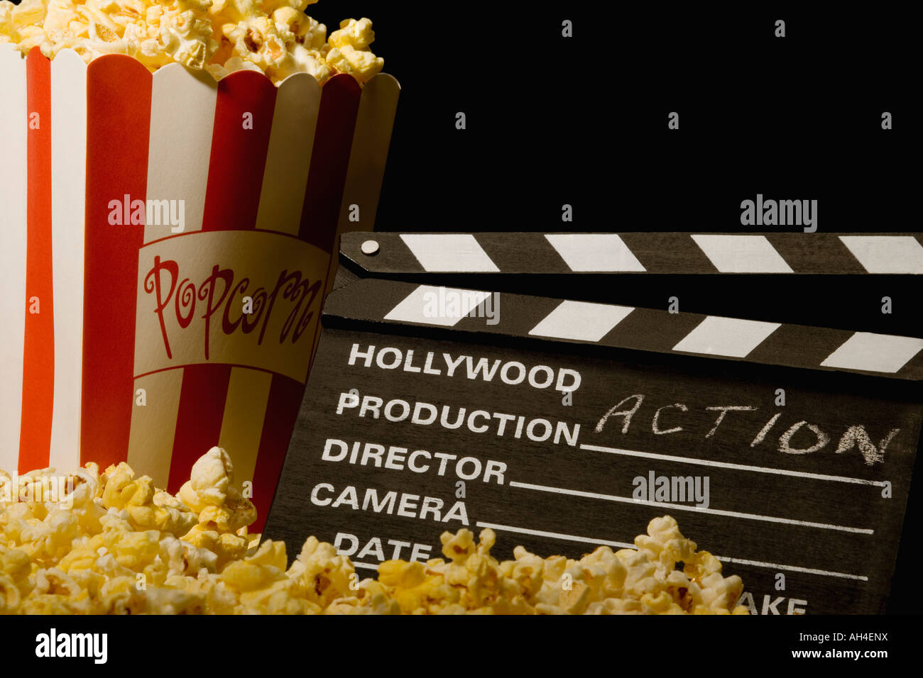 Action movie clapboard with popcorn Stock Photo