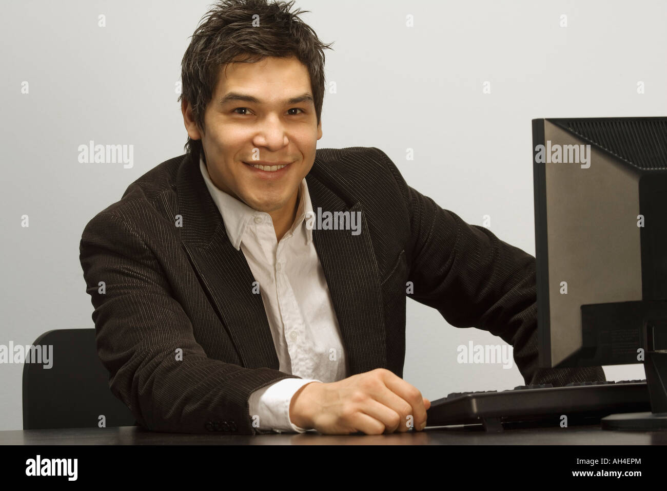 Businessman at computer Stock Photo