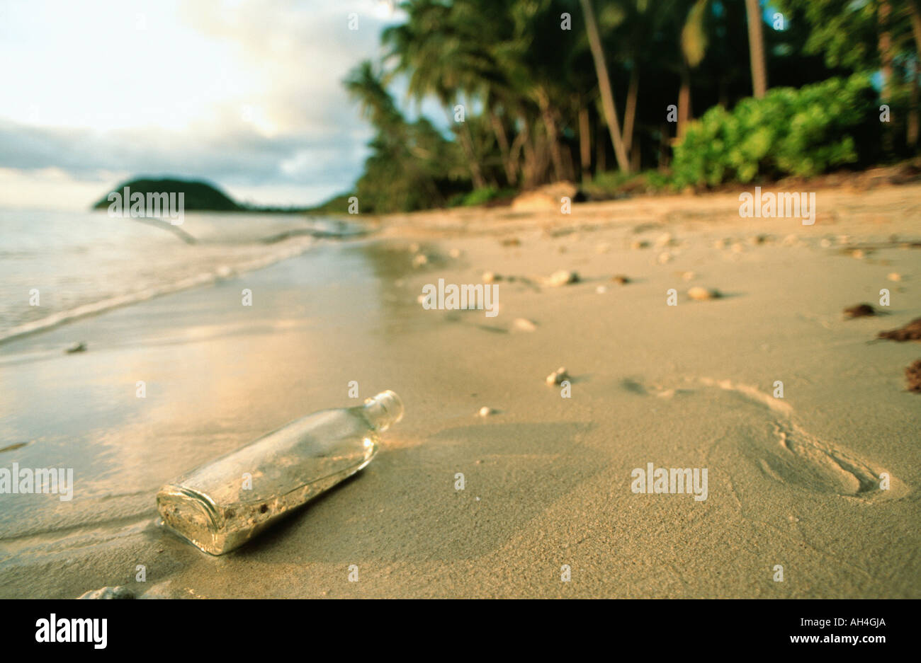 empty bottle washed up on beach, Koh Samui Island, Thailand Stock Photo