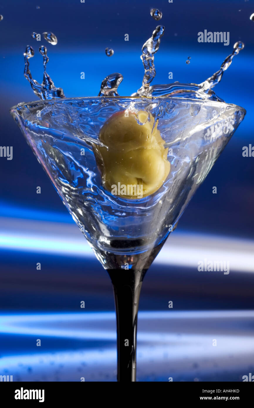 Olive splashing into a Martini Stock Photo Alamy