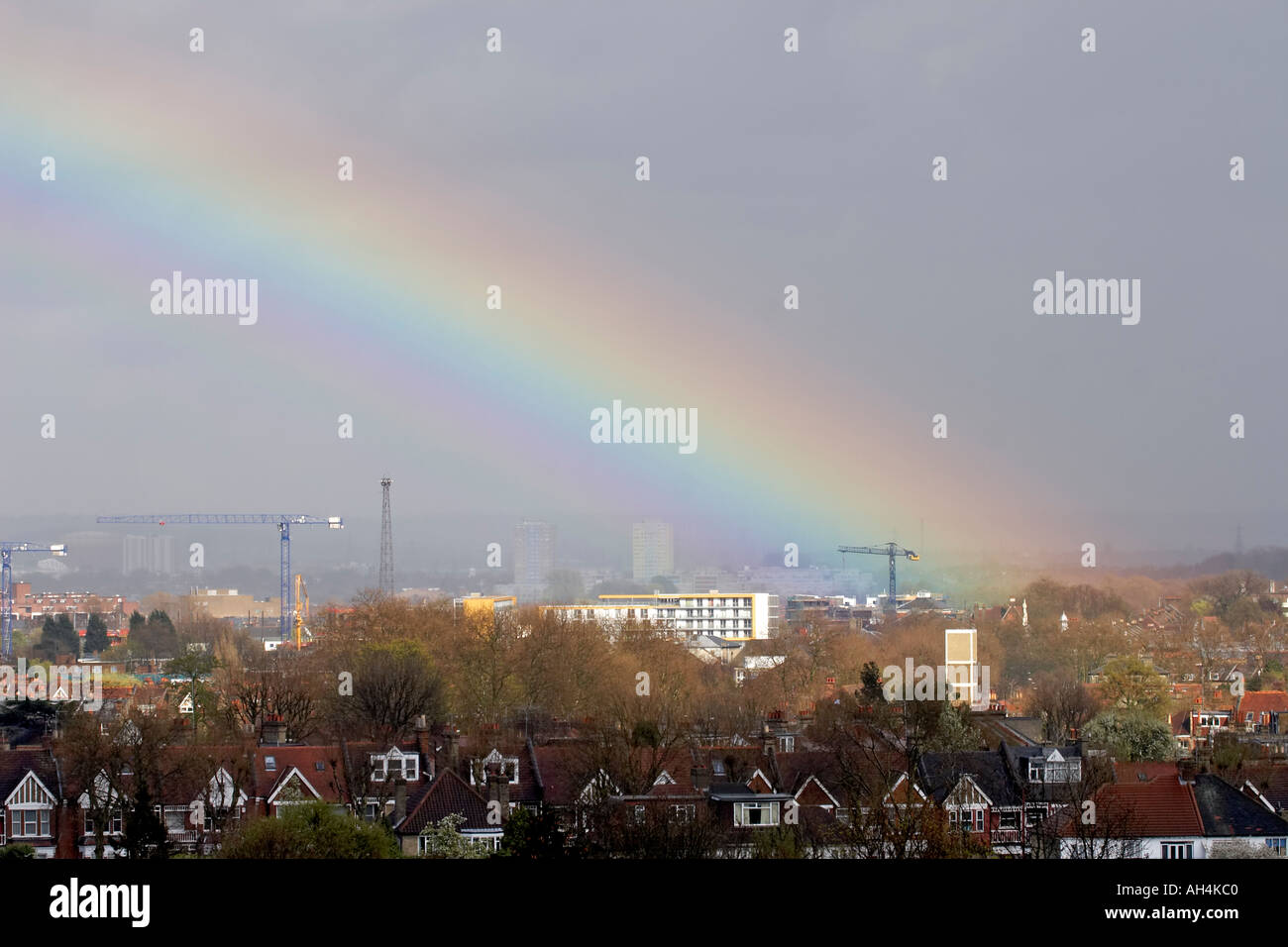 View of rainbow across suburbs and rooftops of north London from