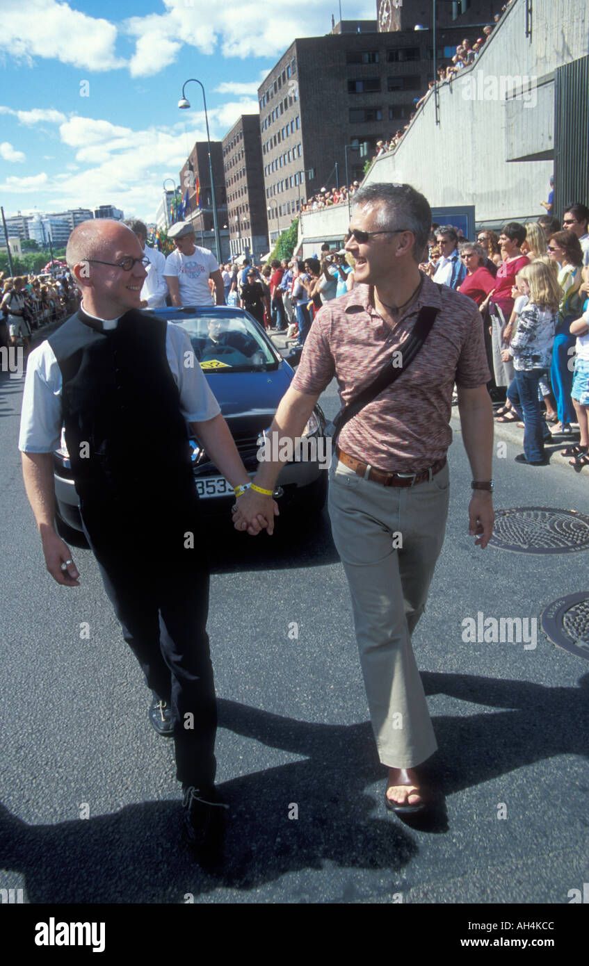 Priest and friend holding hands at Euro pride Oslo Stock Photo
