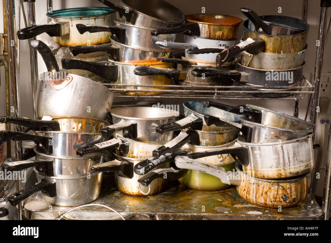 Pots and Pans in a messy stack Stock Photo