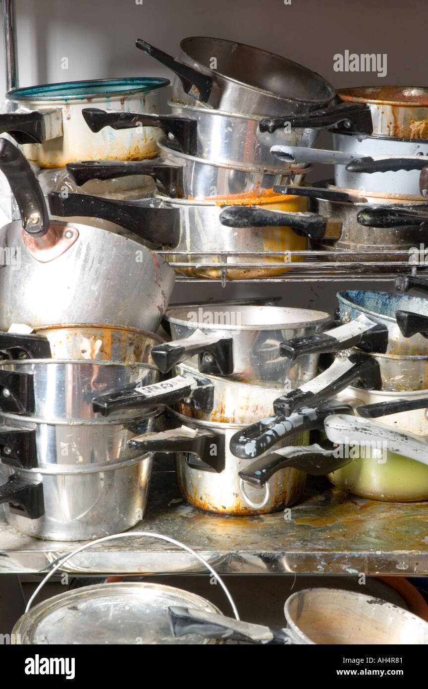 Pots and Pans in a messy stack Stock Photo - Alamy