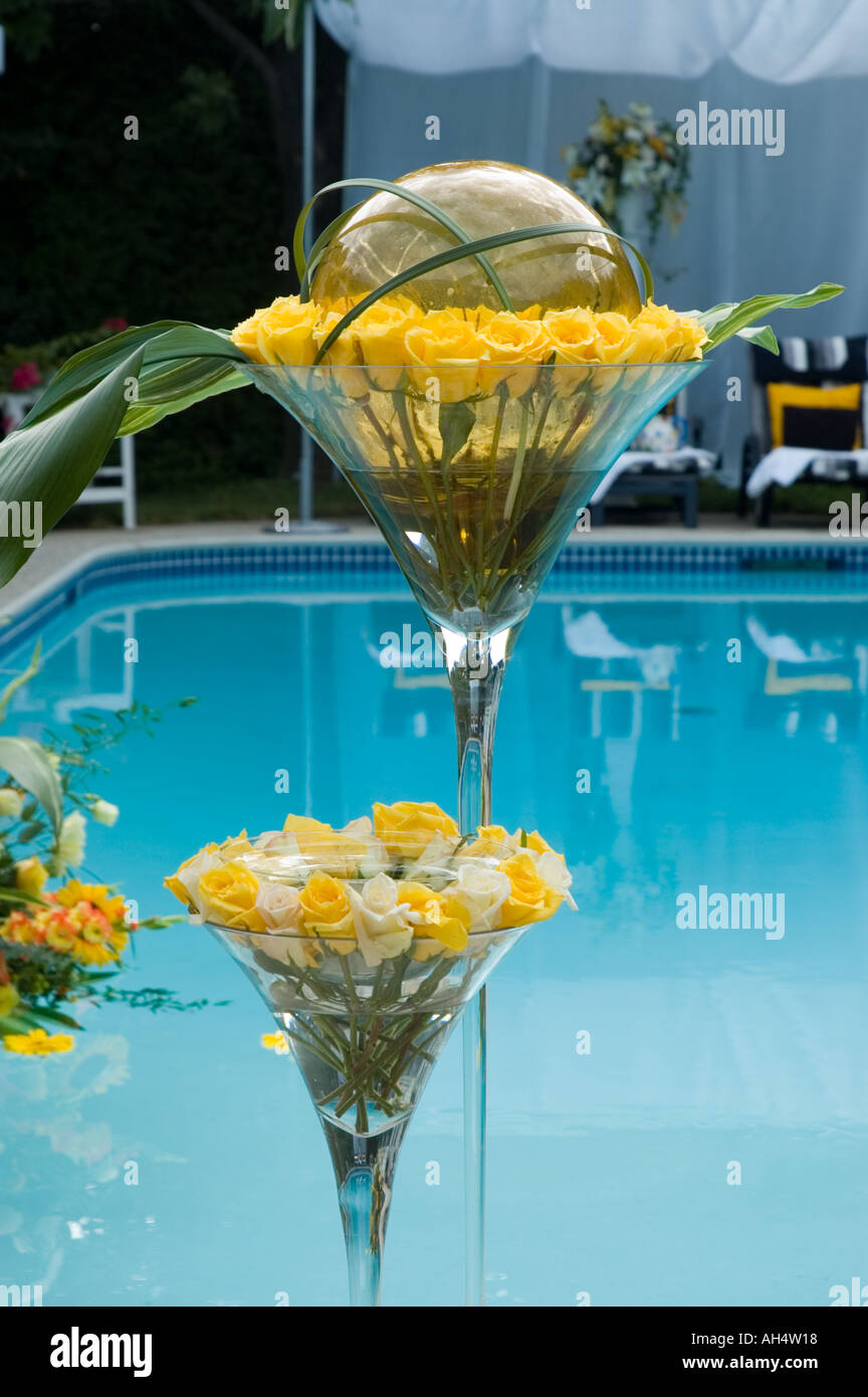 Flowers pool lounge chairs and summer time heat Stock Photo