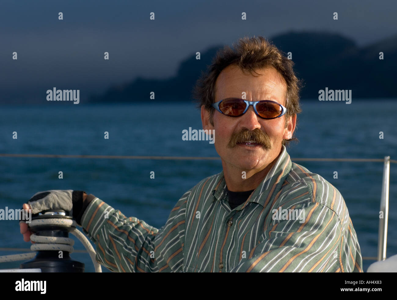 Sea Captain navigating his yacht in San Francisco Bay Stock Photo - Alamy