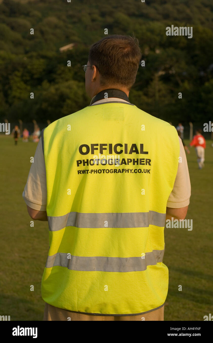 Official photographer wearing high visibility vest Wales International Soccer Tournament
