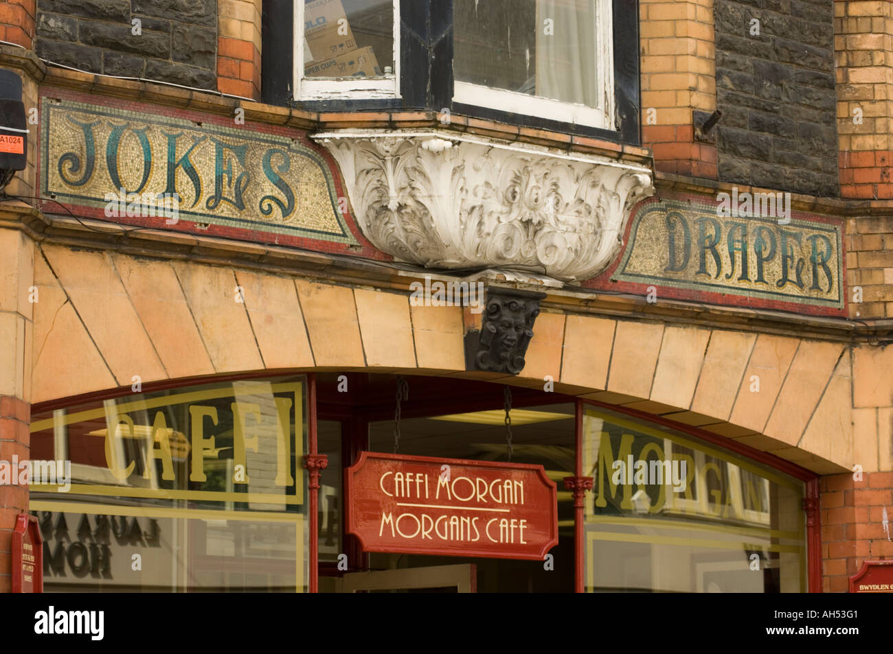Ornate victorian shop front and mosaic signage Morgan's Cafe terrace road Aberystwyth ceredigion Stock Photo