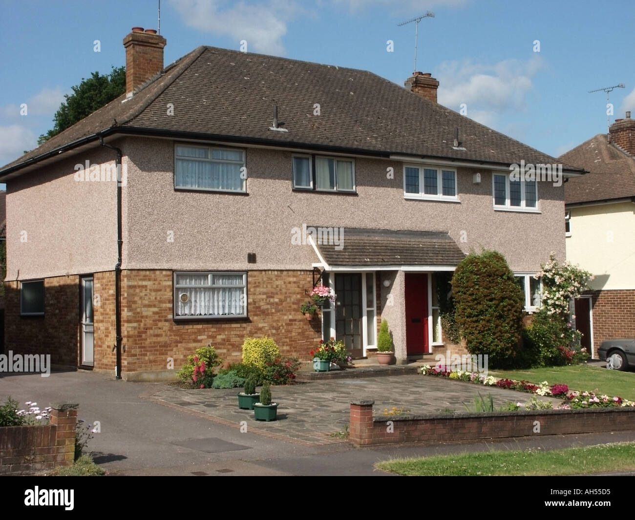 suburban semi detached house and front garden walking distance to fast rail service to London Stock Photo