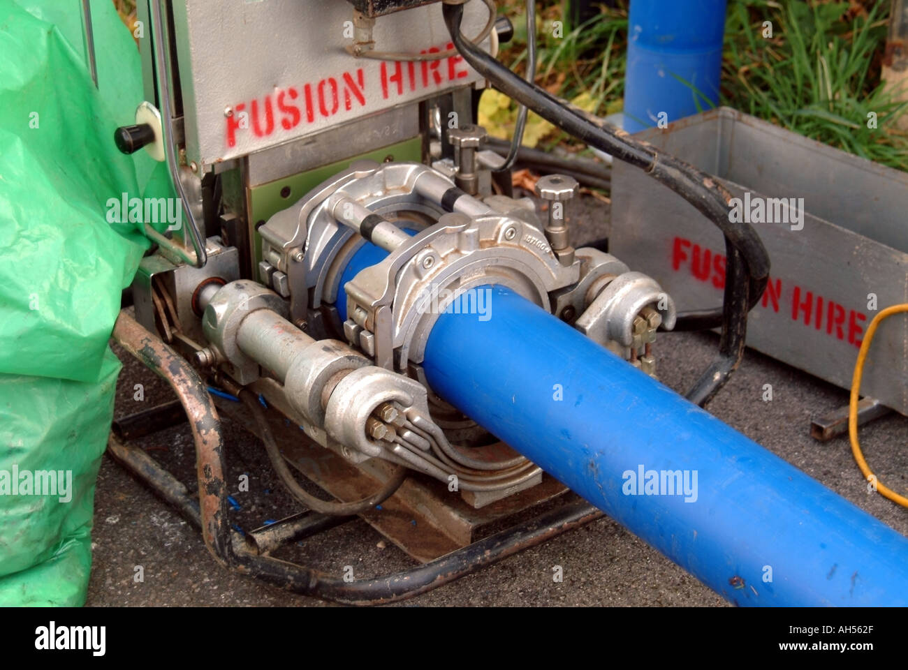 Brentwood blue plastic water main pipes in welding machine to make continuous length of pipe