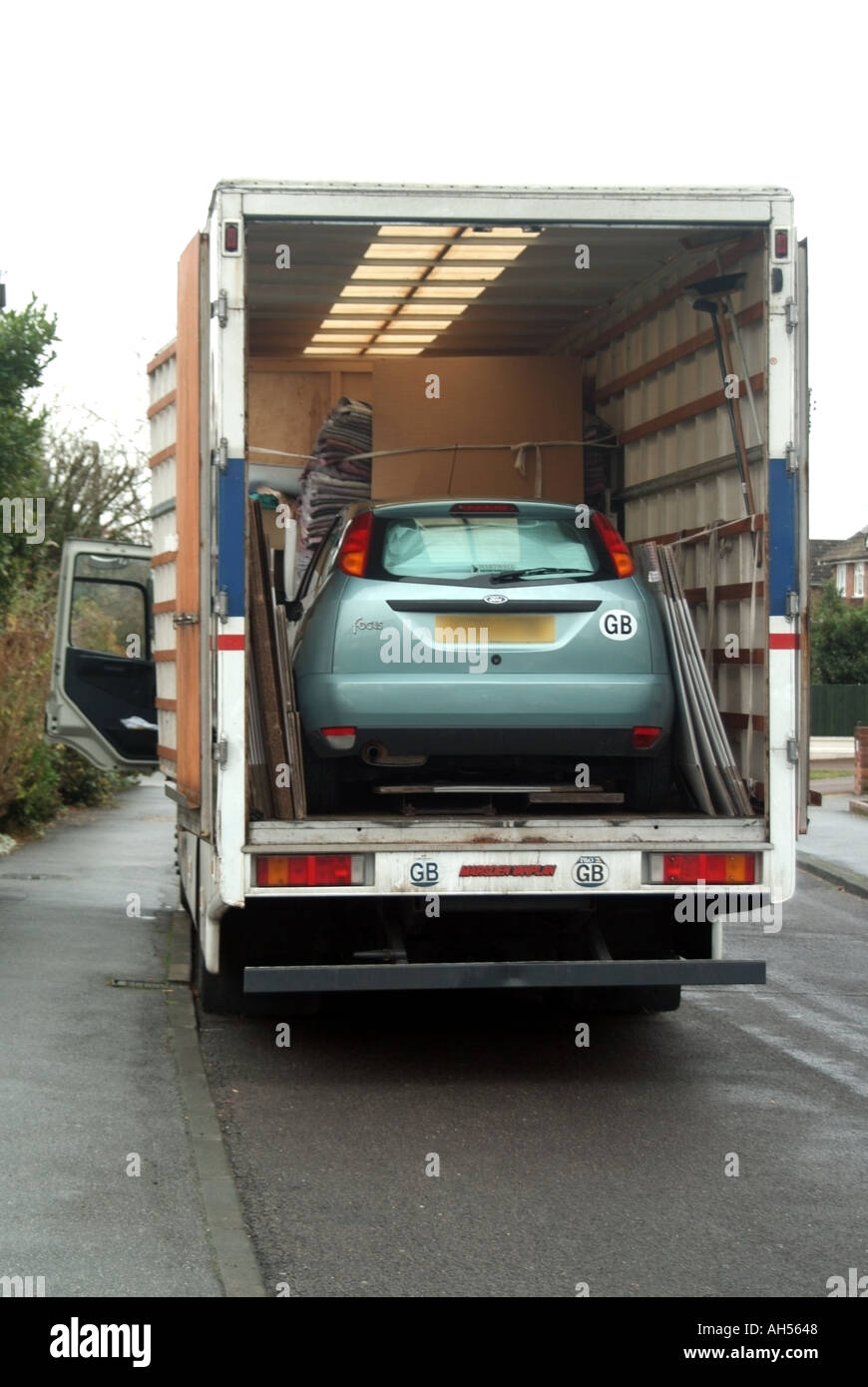 Removal van with Ford Focus car loaded inside Stock Photo Alamy