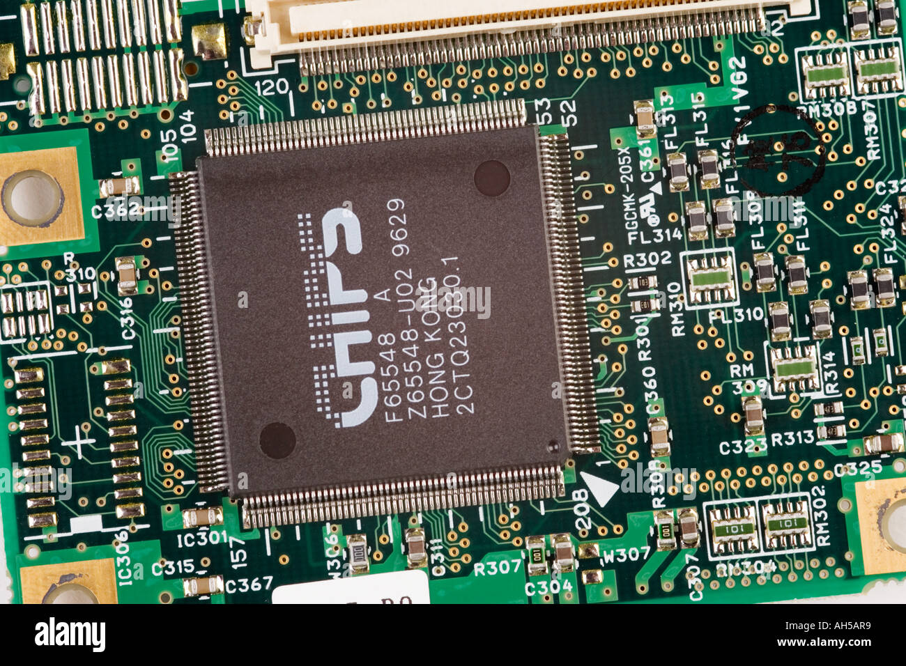 close up of a laptop computer main circuit board showing various