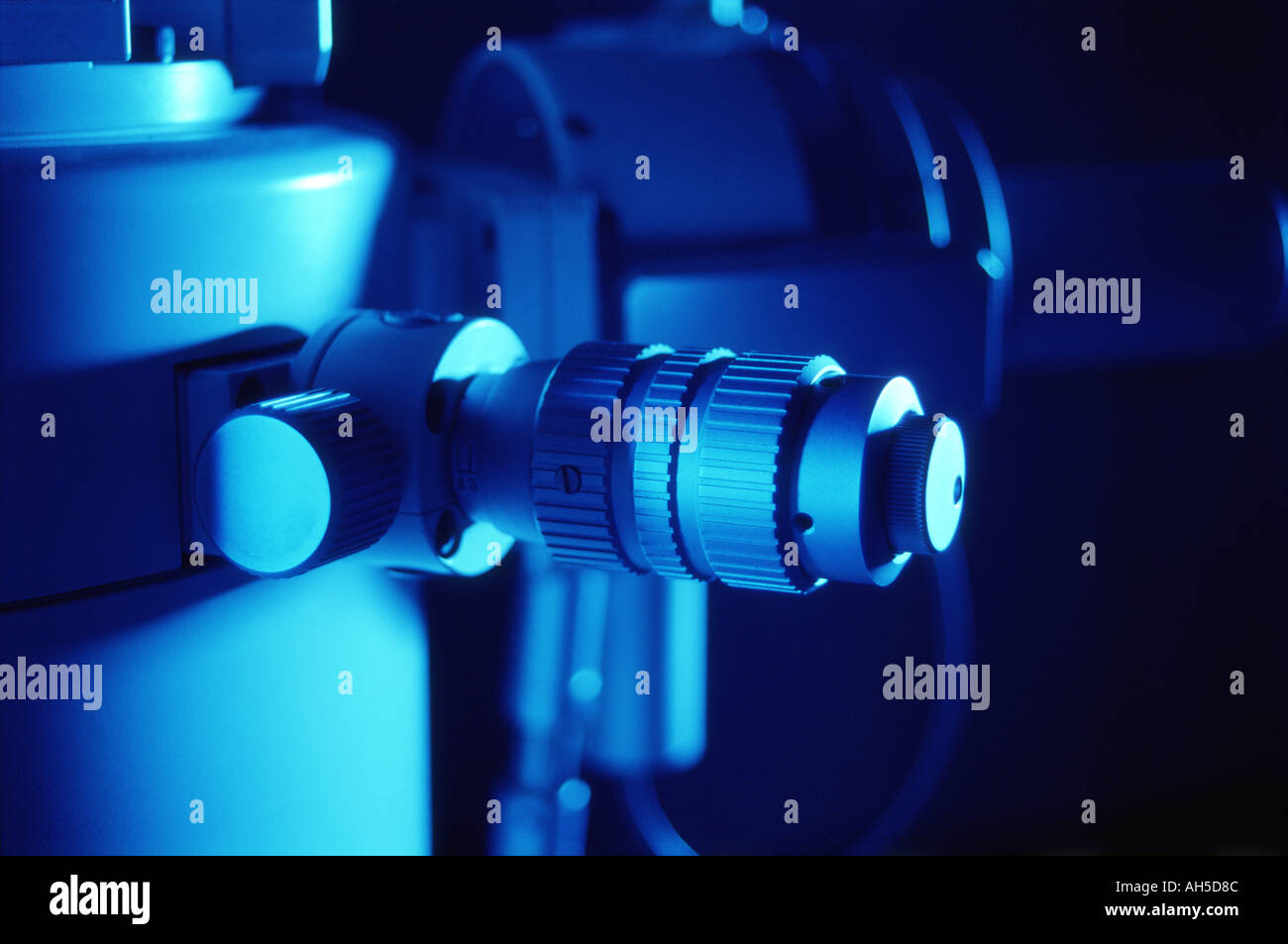 Control knobs of electron microscope in blue light Stock Photo Alamy