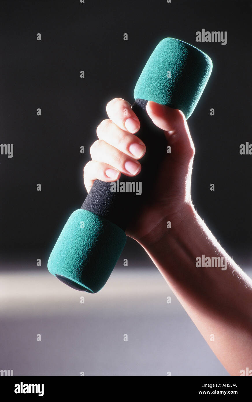 Female exercising with hand weights  Stock Photo