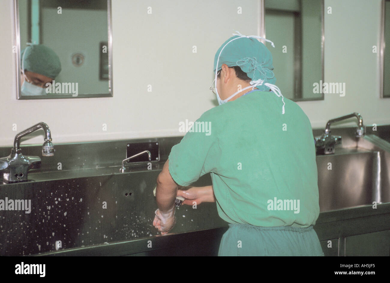 Surgeon in hospital washing and scrubbing up before surgery Taiwan