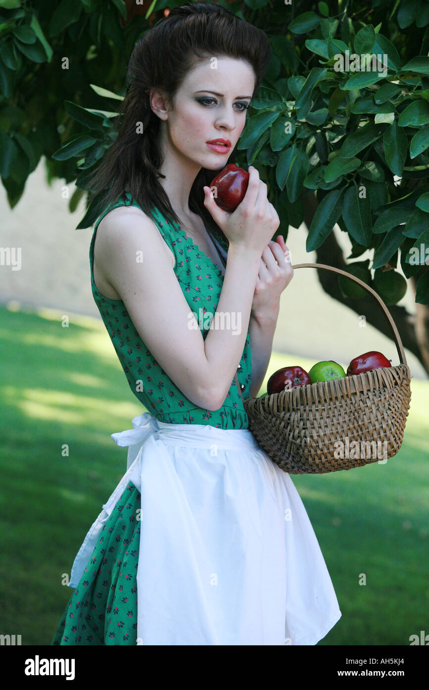 model with her basket of apples Stock Photo