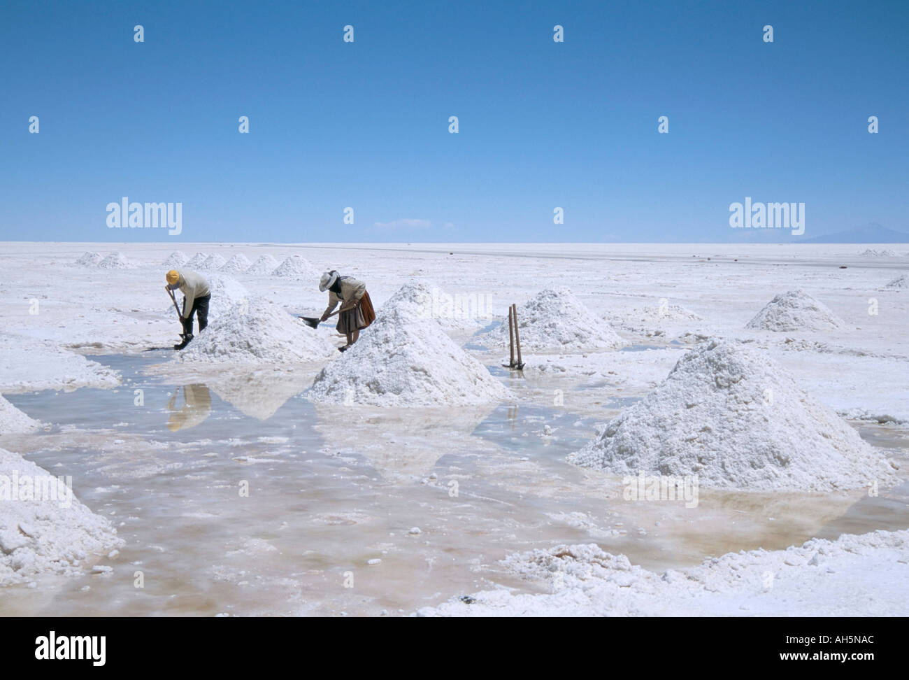 Hand working in Colchani salt pans Salar de Uyuni salt flat Southwest Highlands Bolivia South America Stock Photo