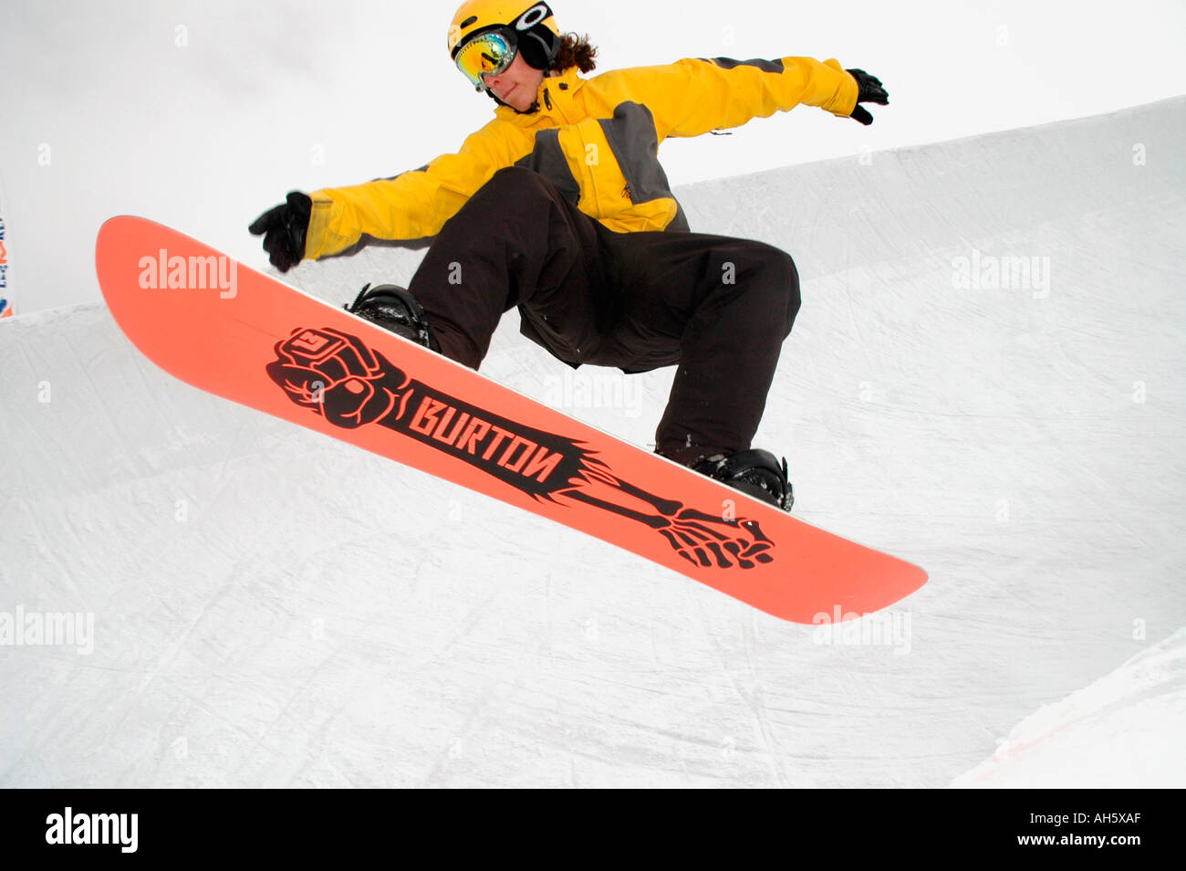 Snowboarder riding the half pipe on the glacier at Les Deux Alpes, France Stock Photo