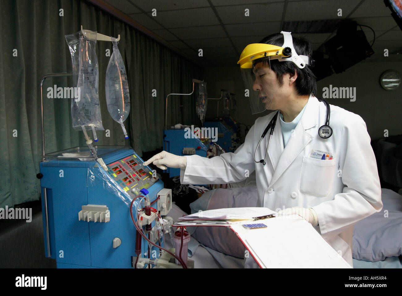 Doctor examines the machine for patient with dialysis shunt Stock Photo