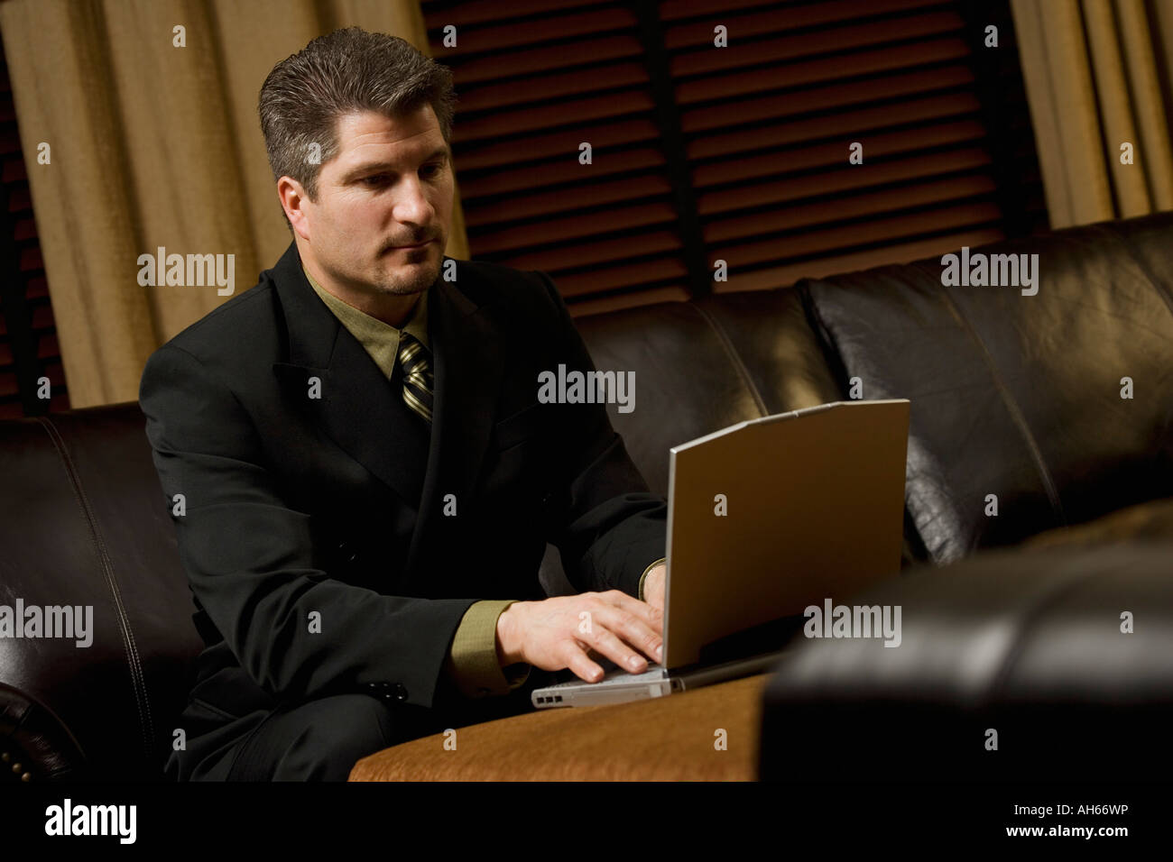 Businessman working on laptop on the coffee table Stock Photo