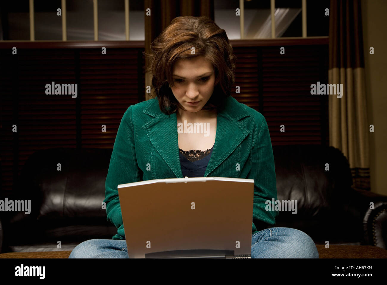 A woman using a laptop Stock Photo