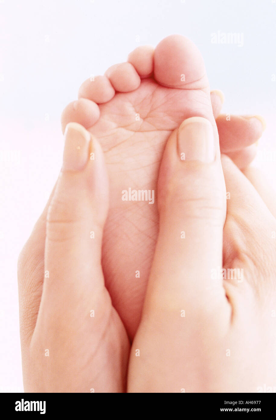 Baby foot massage Stock Photo Alamy
